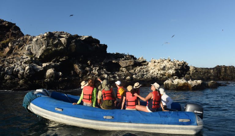 Pitt Point - San Cristobal in Galapagos Islands, view of the tourist in a panga