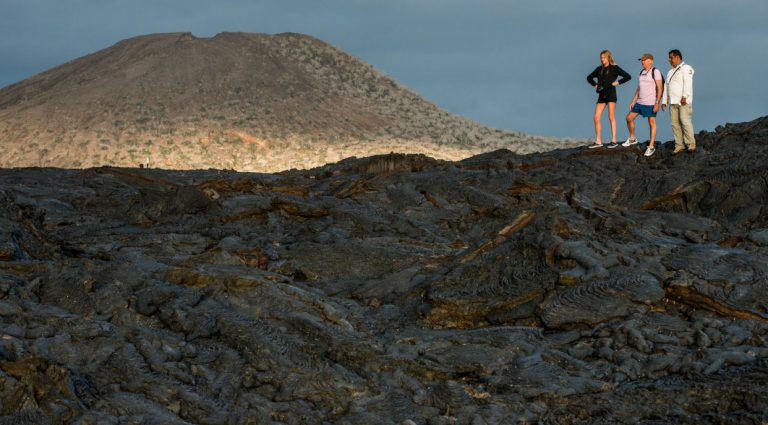 Sullivan bay, solid volcanic lava with tourist watching all