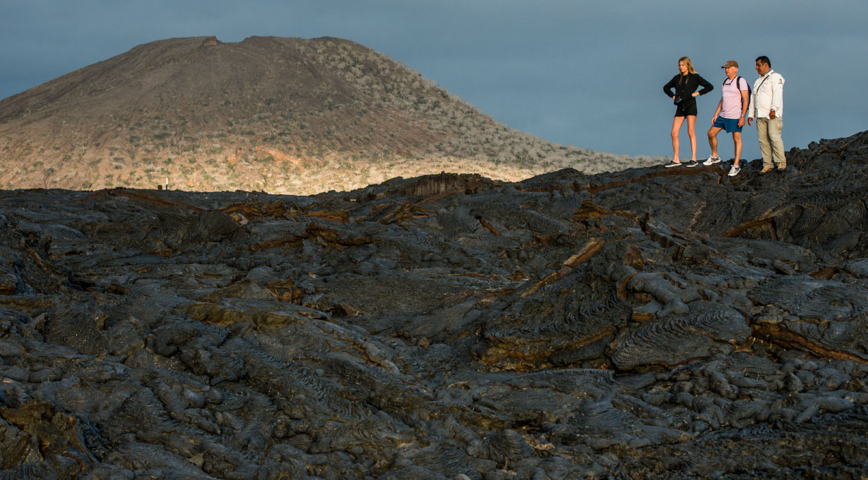 Sullivan bay, solid volcanic lava with tourist watching all